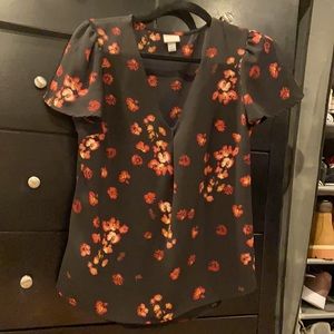 Short sleeve black floral blouse.